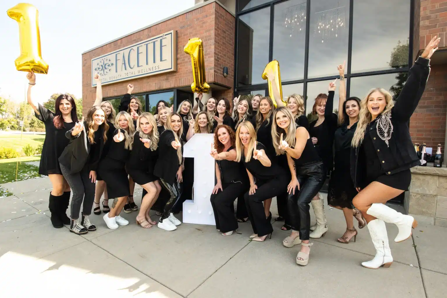 Our team celebrating outside of our Fort Collins Medical Spa and Hair Salon